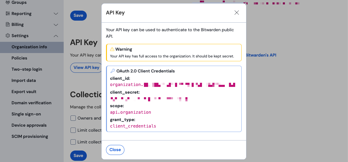 Bitwarden API Key dialog showing client_id prefixed organization, a redacted client_secret, scope api.organization, grant_type client_credentials, and a warning that the API key has full access to the organization